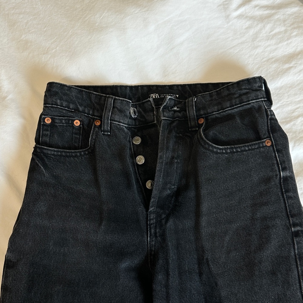 SOLD ankle cropped raw hem black jeans